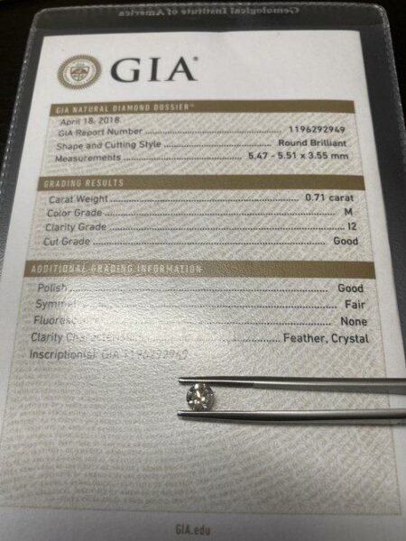 GIA Certified 0.71 Carat M I2 Round Brilliant Diamond - Image 2