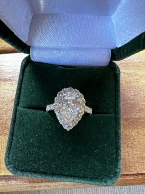 Lab Grown 2.02 f,vs2 IGI certified pear shaped diamond set in a halo style setting