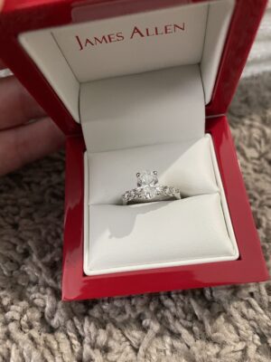 1.36 Gia certified lab-grown  oval D,vvs2 with .42 carat platinum setting with six stones. James Allen