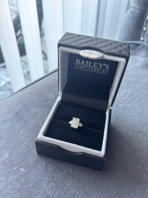 3.01 CT G VS2 Lab Grown Emerald Cut Center Diamond with Two 0.42 CTW Pear Cut Diamond Ring